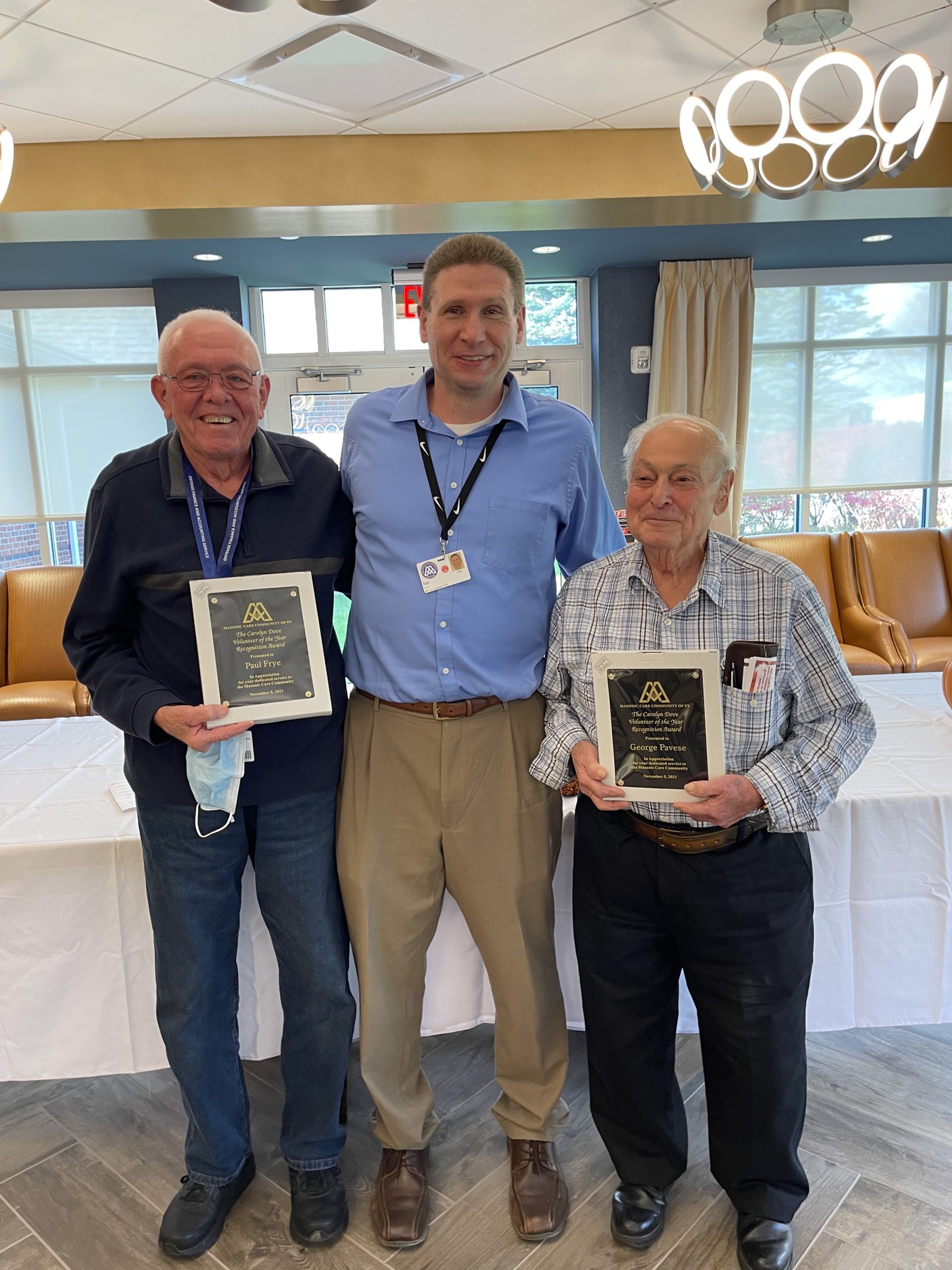 Paul and George receiving awards at Masonic Care Community