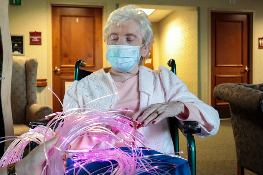 elderly resident getting sensory therapy in snoezelen room