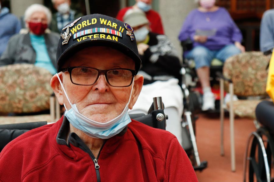 world war 2 veteran posing while seated in resident home